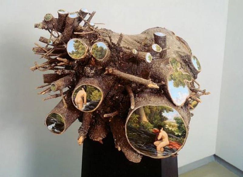 Ağaç kütükleri üzerine çizilmiş gerçek manzaralar