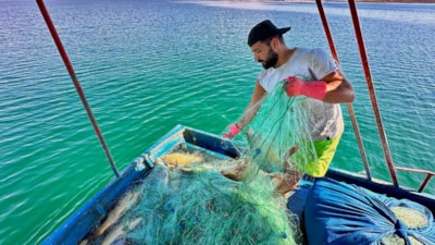Tunceli'de gölden balık avlayarak ayda 200 bin TL kazanıyor