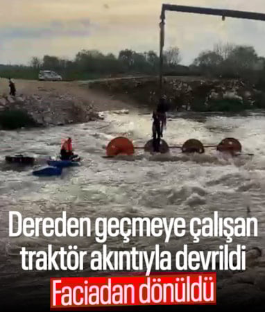 Bursa'da dereden geçmeye çalışan traktör ve üstündeki işçiler akıntıyla devrildi