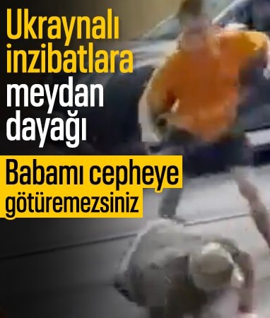 Ukrayna'da bir genç babasını cepheye götürmek isteyen askerleri dövdü