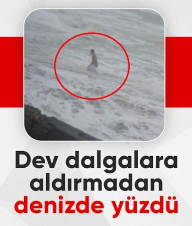 Hatay'da fırtınaya aldırmadı, dev dalgalar arasında denize girdi