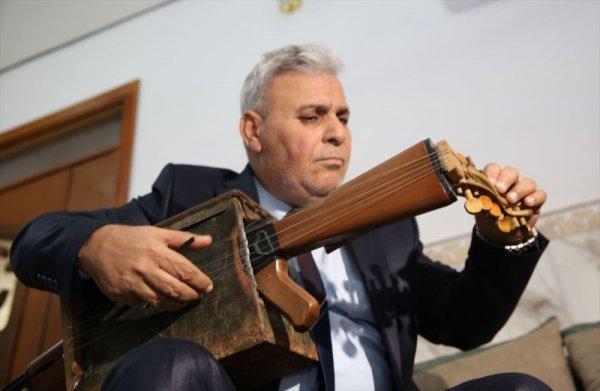 Irak'ta öğretmen silahı müzik aletine çevirdi