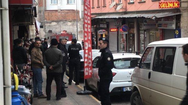 Elinde tüfek ve benzin bidonuyla dükkan bastı