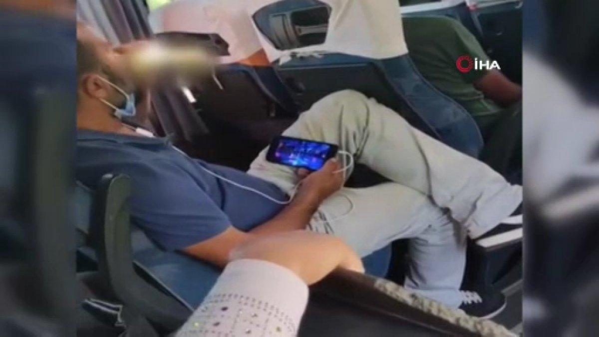 Antalya'da yolcu minibüsünde maskesini düzgün takmayan yolcunun pes dedirten görüntüleri