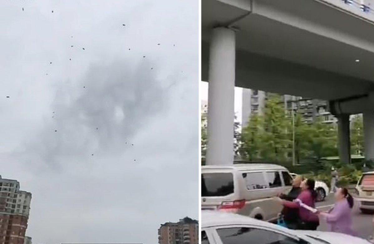 Çin'de yoldan geçenlerin üzerine para yağdırma anı kamerada