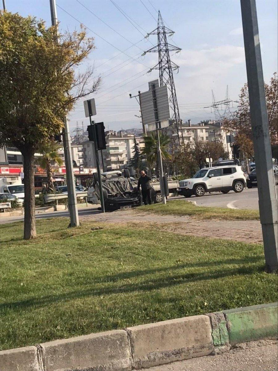 Bursa'da virajı alamayan sürücü takla attı