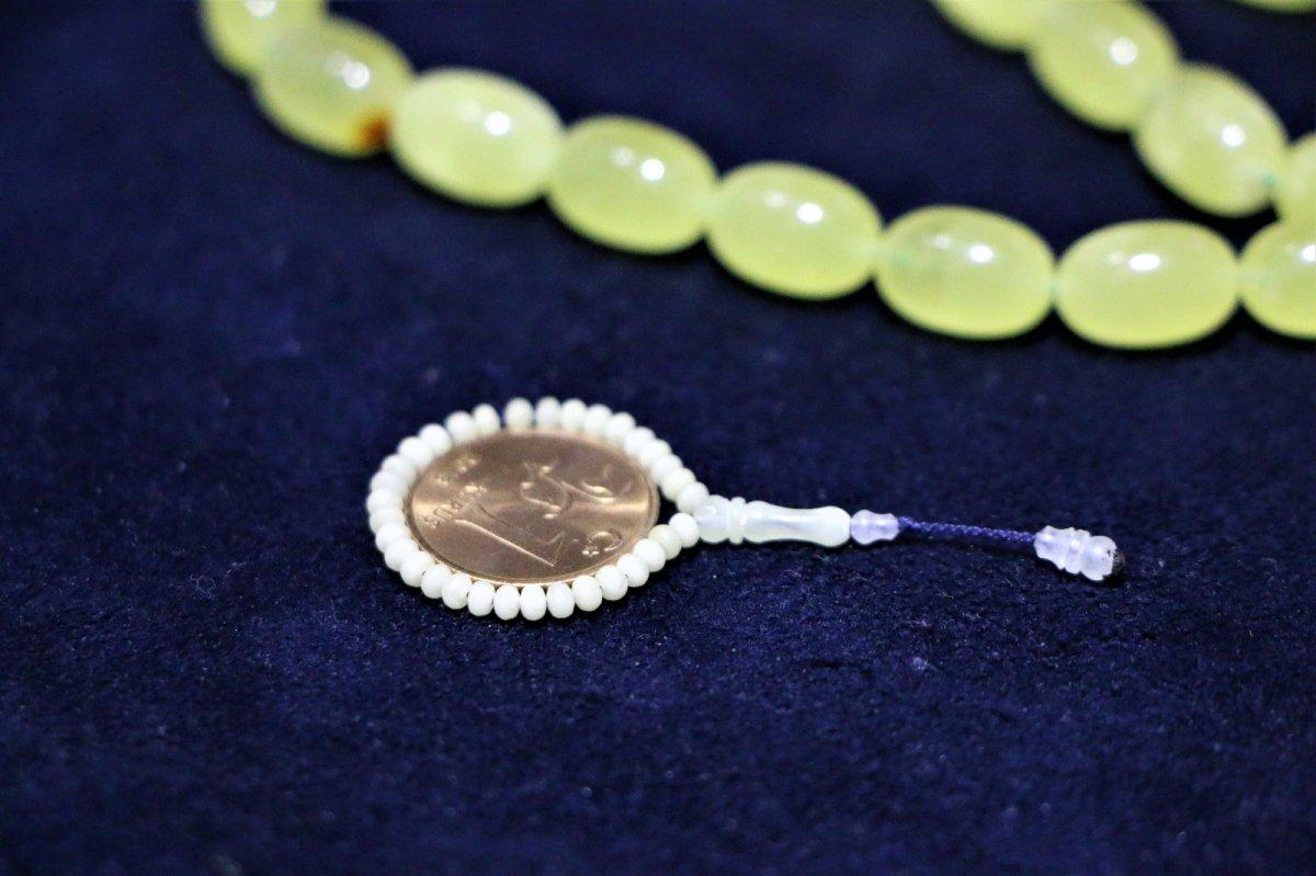 Elazığ'da 50 milyon yıllık fosil damla kehribardan dünyanın en küçük tespihini yaptı