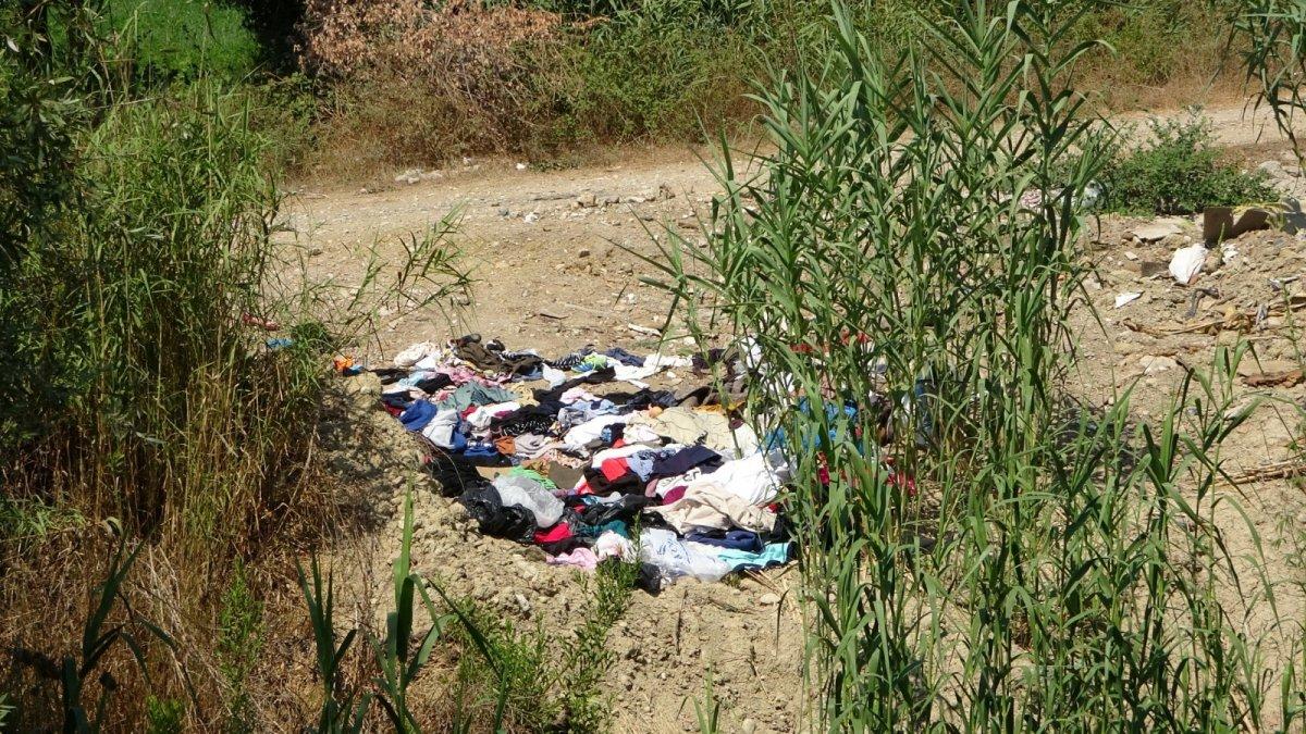 Manavgat'ta yardım için gönderilen kıyafetler dere kenarına atıldı