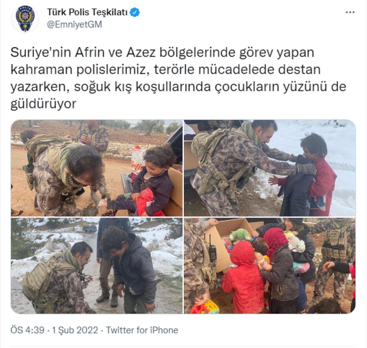 Türk polisi, Suriye'de üşüyen çocukları giydirdi